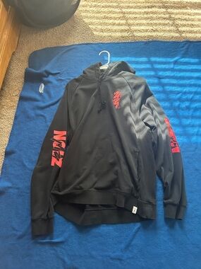 Zion Rootswear Black Hoodie with Red Sleeve and Chest Graphics